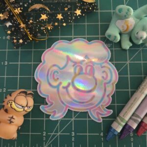 This is how Mac draws himself! Slap a Tiny Mac anywhere you wanna! 2.5" x 3" glossy holographic sticker.